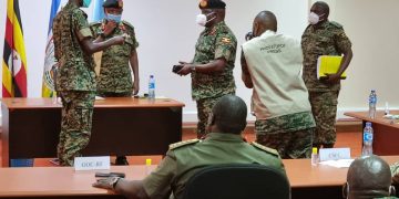 Gen Kandiho Hands over Office to New CMI Chief Gen Birungi