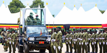 President Museveni watches a military parade by cadet officers during their passout at the Uganda Military Academy in Kabamba on Tuesday. PPU Photo