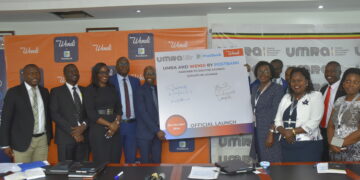 Andrew Kabeera PostBank’s Executive Director (5th L) and Executive Director of UMRA, Edith Tusuubira (3rd R Front) joined by other officials from PostBank Uganda and UMRA during the signing of a Memorandum of Understanding (MoU) to initiate a collaboration aimed at digitising the operations of tier IV Microfinance Institutions through PostBank’s Wendi mobile wallet, so that the last mile beneficiary can actively participate in socio-economic ventures that will improve their livelihood. The event was held at UMRA Offices today 21st October 2024.