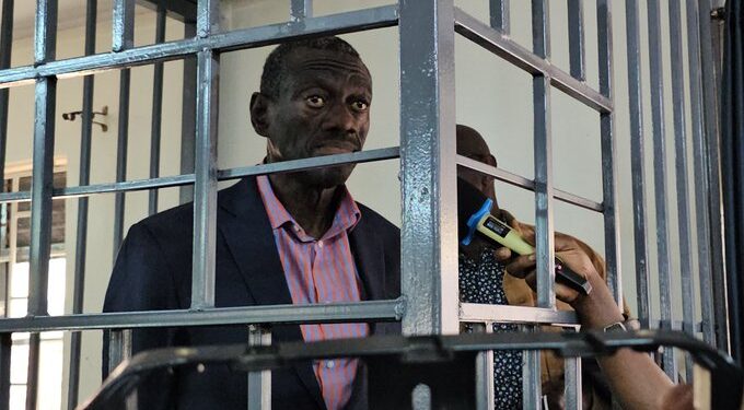 Dr Kizza Besigye in the dock at the General Court Martial in Makindye (Photo by 
Kungu Al-mahadi Adam)