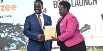 VP Alupo Launches “Moments with Mzee” Book, Lauds Photographer Abu Mwesigwa